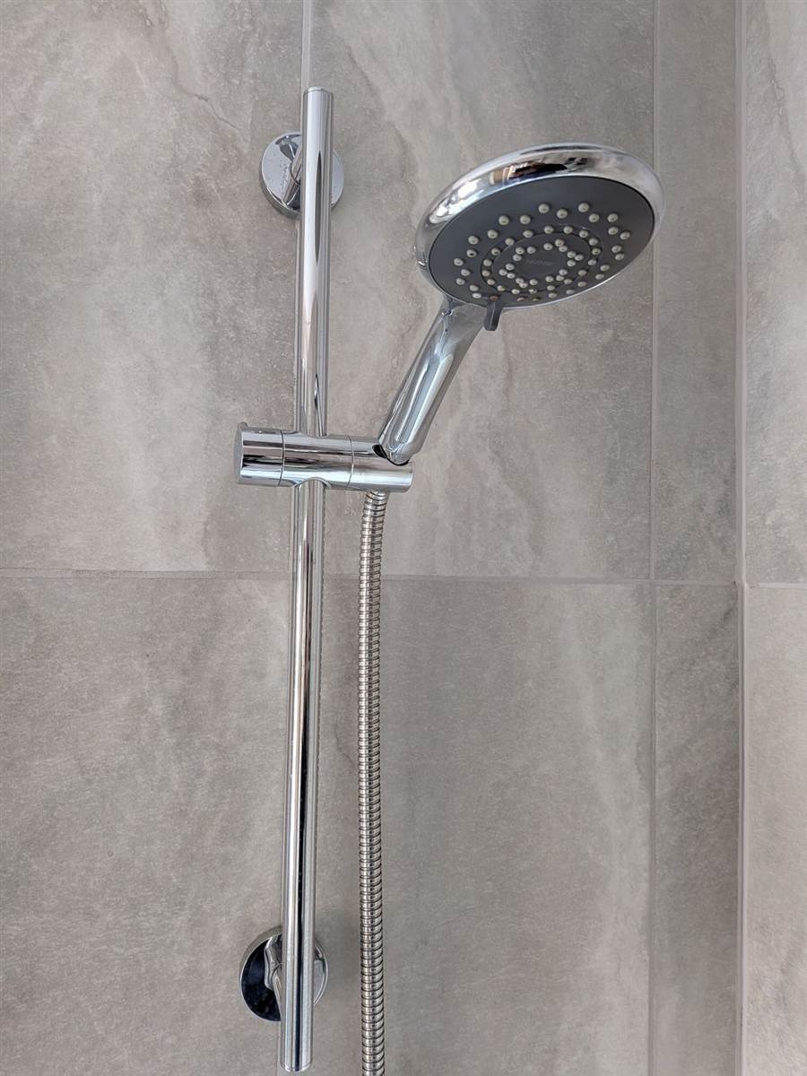 Shower riser rail replaced — new fittings, properly secured