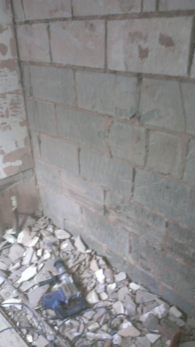 Stripped back to bare blockwork — everything removed, starting from scratch