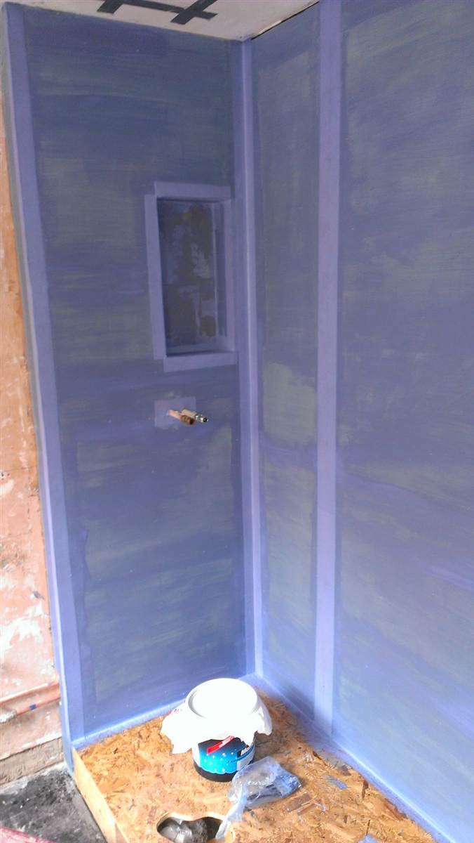 Full tanking membrane applied to all walls before tiling — watertight for the long term